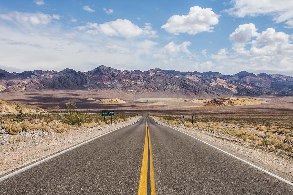road centralized photography of asphalt road death valley national park